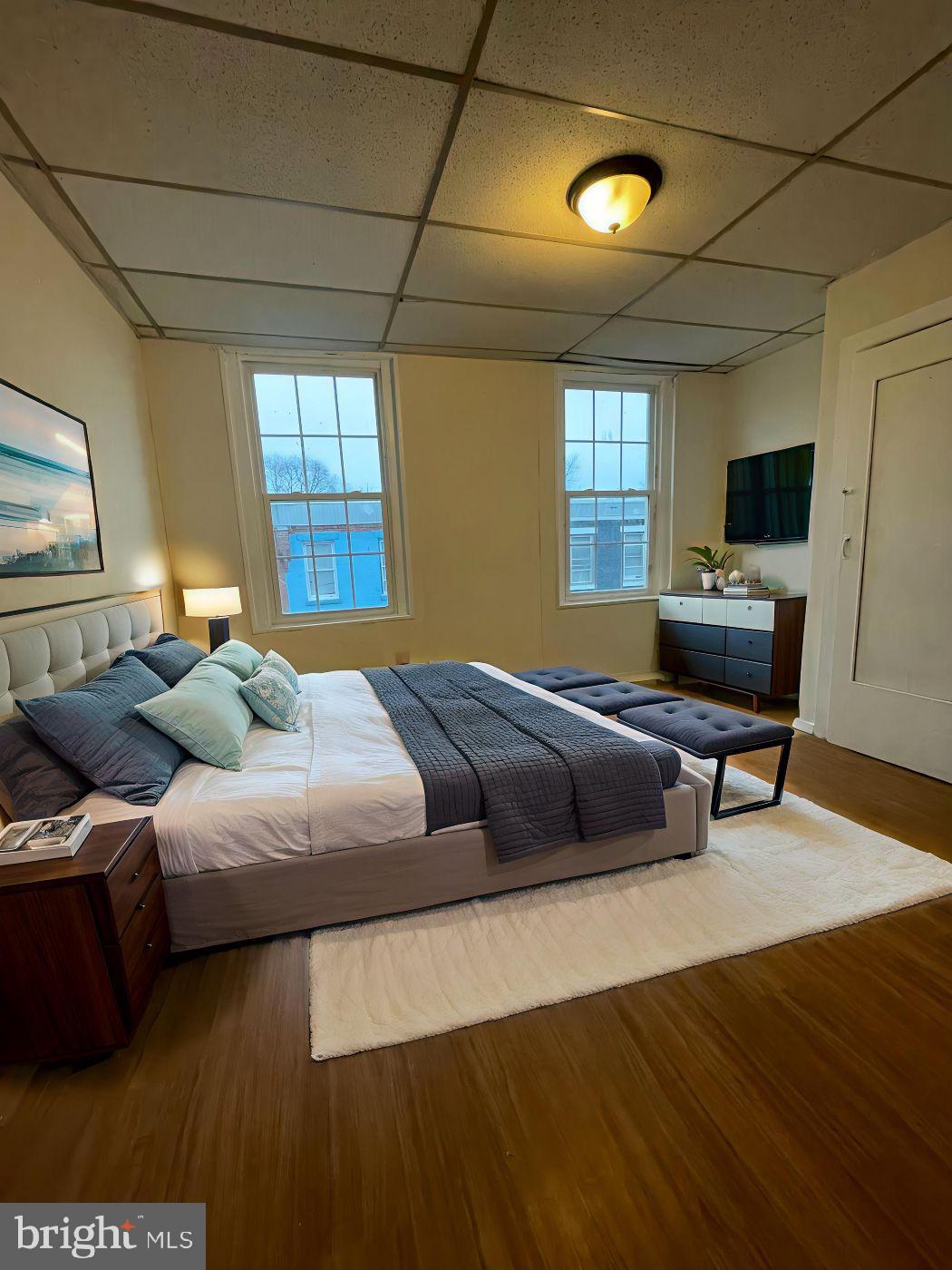 3432 Ormes Street Philadelphia, PA 19134 - Photo 2 of 10 a bedroom with a bed and a couch