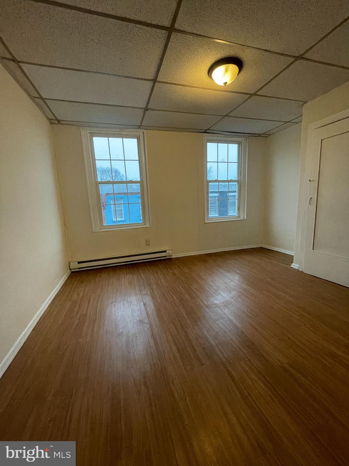 3432 Ormes Street Philadelphia, PA 19134 - Photo 6 of 10 a view of wooden floor and windows in a room