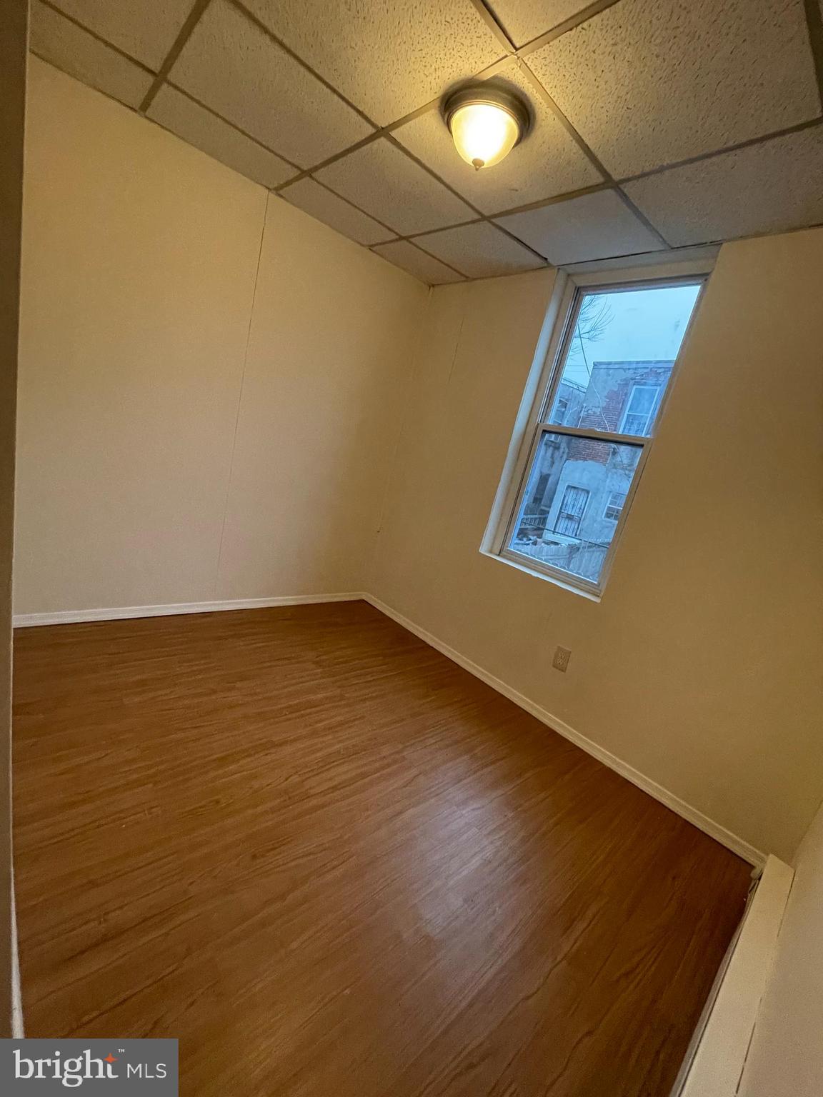 3432 Ormes Street Philadelphia, PA 19134 - Photo 7 of 10 en empty room with wooden floor and fan