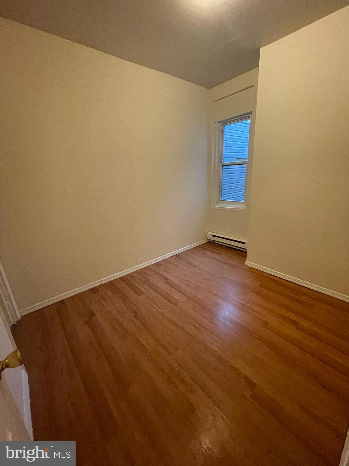 3432 Ormes Street Philadelphia, PA 19134 - Photo 8 of 10 a view of an empty room with wooden floor