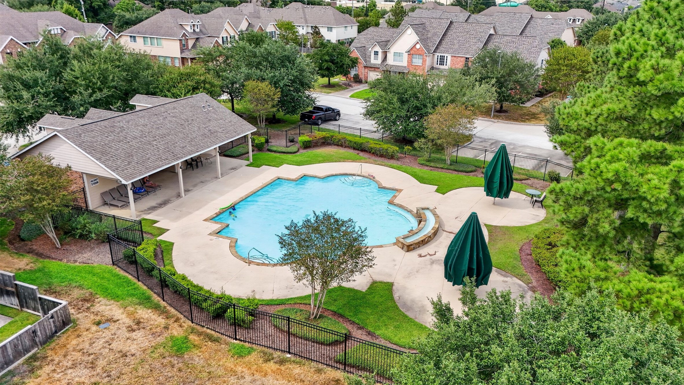 10510 Day Trail Lane Spring, TX 77379 - Photo 27 of 28 The community has a pool with covered area for your family to sit and relax while enjoying watching the children splash around in the water.