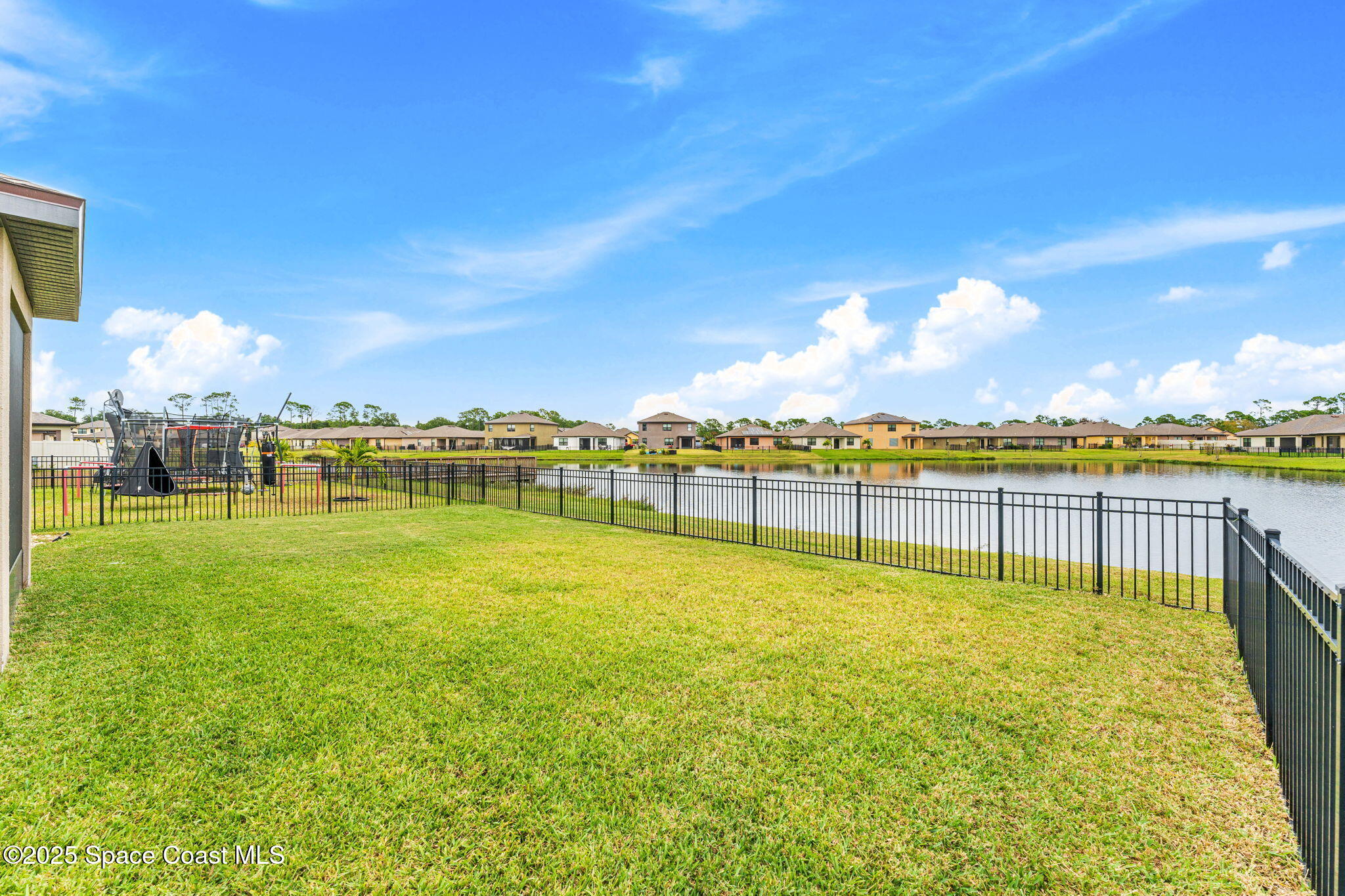 4901 Talbot Boulevard Cocoa, FL 32926 - Photo 28 of 39 a view of a swimming pool with an outdoor seating and a garden