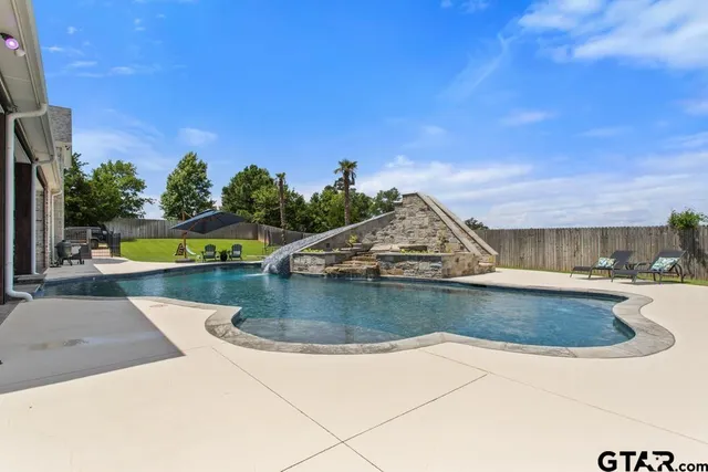 a view of a house with swimming pool