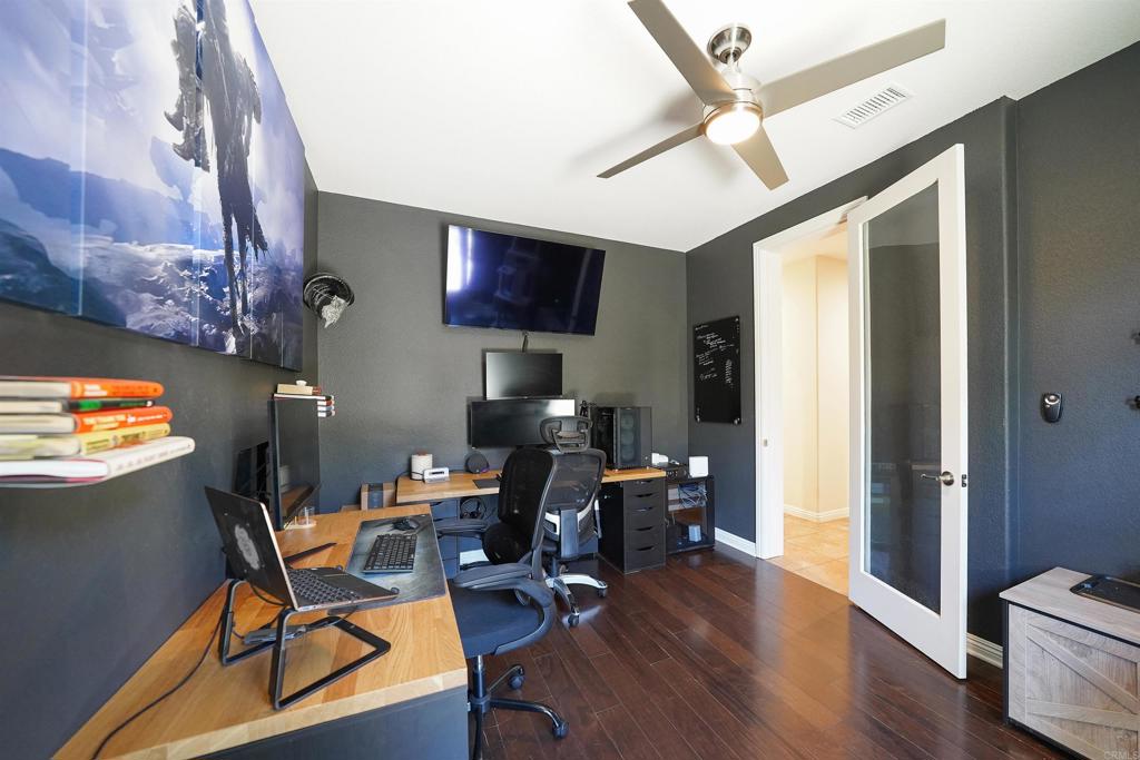 22963 Stokes Road Ramona, CA 92065 - Photo 40 of 57 a workspace with furniture hardwood and a window