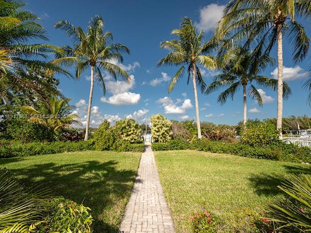 585 Southwest Yacht Basin Way Stuart, FL 34997 - Photo 11 of 61 a view of a yard and front view of a house