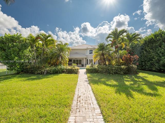 585 Southwest Yacht Basin Way Stuart, FL 34997 - Photo 12 of 61 a front view of a house with swimming pool