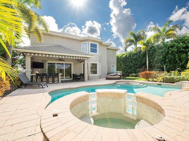 585 Southwest Yacht Basin Way Stuart, FL 34997 - Photo 13 of 61 a view of a house with swimming pool and sitting area