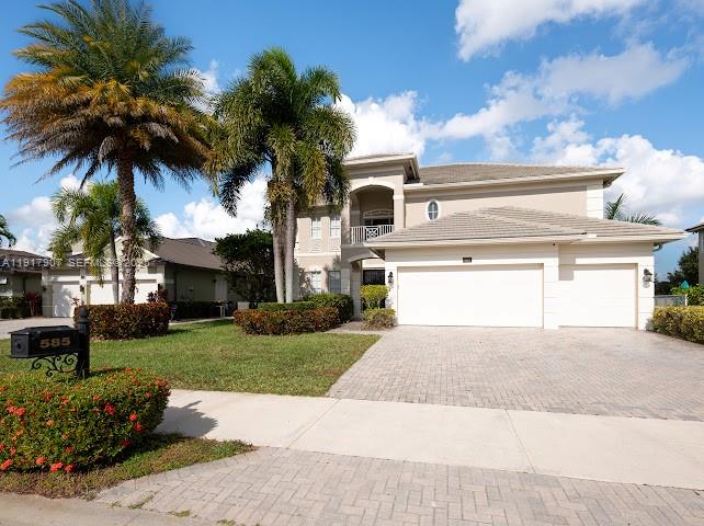 585 Southwest Yacht Basin Way Stuart, FL 34997 - Photo 15 of 61 a front view of house with yard and green space