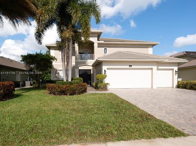 585 Southwest Yacht Basin Way Stuart, FL 34997 - Photo 17 of 61 a view of a house with a yard and garage