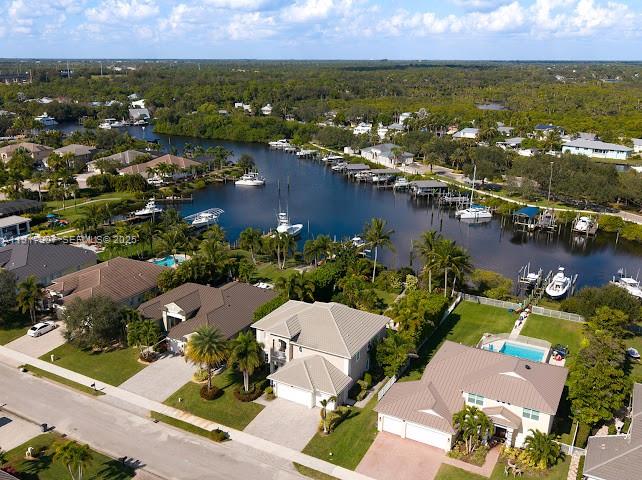 585 Southwest Yacht Basin Way Stuart, FL 34997 - Photo 18 of 61 an aerial view of residential houses with outdoor space