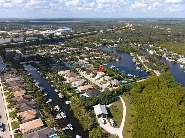 585 Southwest Yacht Basin Way Stuart, FL 34997 - Photo 23 of 61 an aerial view of residential houses with outdoor space