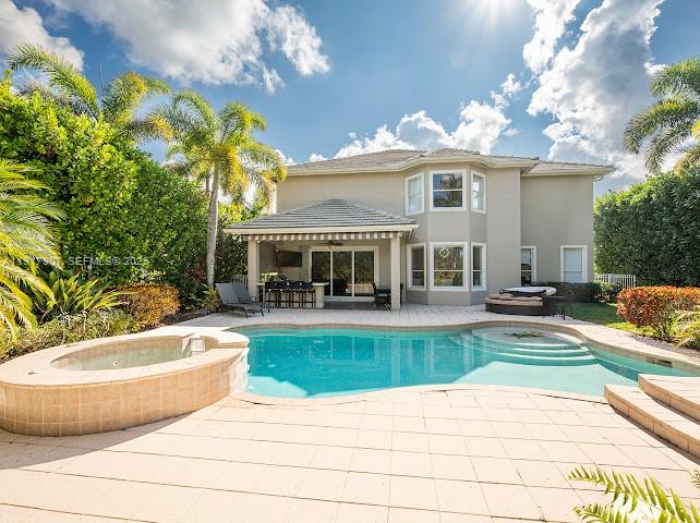 585 Southwest Yacht Basin Way Stuart, FL 34997 - Photo 3 of 61 a view of a house with swimming pool and sitting area