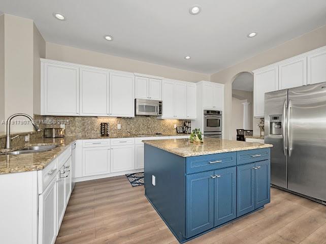 585 Southwest Yacht Basin Way Stuart, FL 34997 - Photo 31 of 61 a kitchen with a sink stove and refrigerator