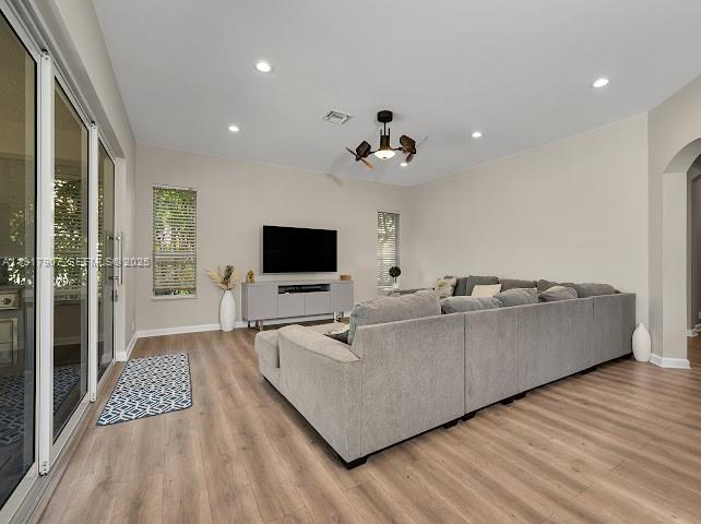 585 Southwest Yacht Basin Way Stuart, FL 34997 - Photo 35 of 61 a living room with furniture and a flat screen tv