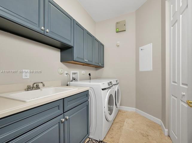 585 Southwest Yacht Basin Way Stuart, FL 34997 - Photo 38 of 61 a utility room with cabinets washer and dryer