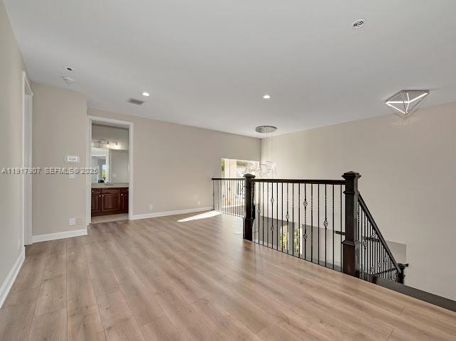 585 Southwest Yacht Basin Way Stuart, FL 34997 - Photo 42 of 61 a view of a hallway with wooden floor and staircase