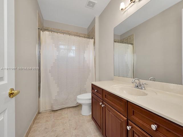585 Southwest Yacht Basin Way Stuart, FL 34997 - Photo 45 of 61 a bathroom with a sink a toilet and shower