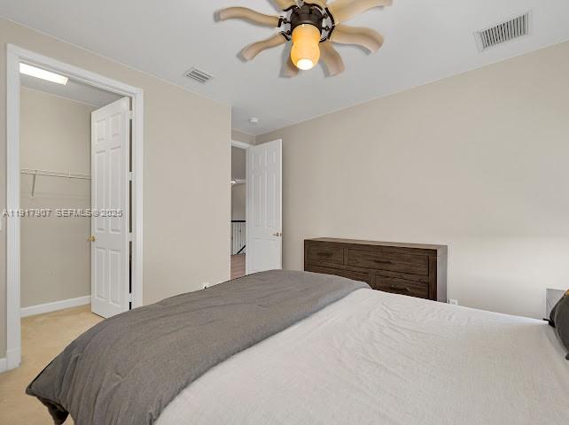 585 Southwest Yacht Basin Way Stuart, FL 34997 - Photo 49 of 61 a bedroom with a bed and a chandelier