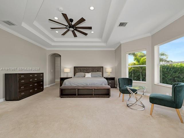 585 Southwest Yacht Basin Way Stuart, FL 34997 - Photo 51 of 61 a spacious bedroom with a bed a couch and a large window