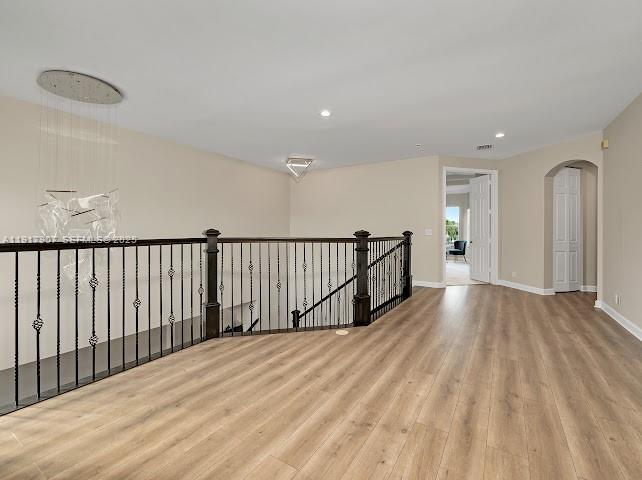 585 Southwest Yacht Basin Way Stuart, FL 34997 - Photo 59 of 61 a view of a hallway with wooden floor