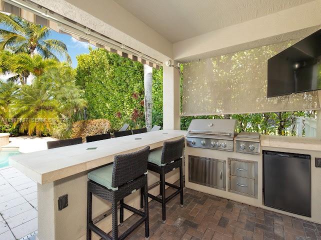 585 Southwest Yacht Basin Way Stuart, FL 34997 - Photo 60 of 61 a kitchen with a sink and a stove top oven