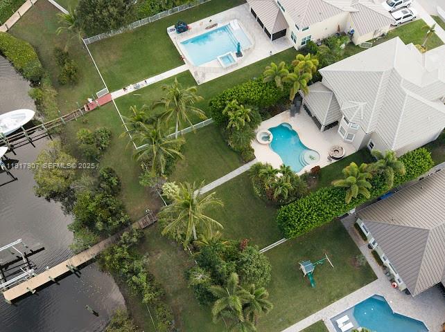 585 Southwest Yacht Basin Way Stuart, FL 34997 - Photo 6 of 61 an aerial view of a house with a yard