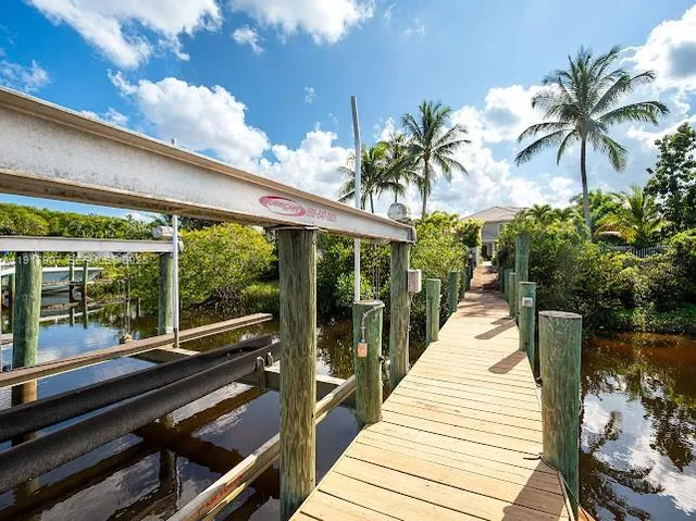 a view of a house with swimming pool and sitting area