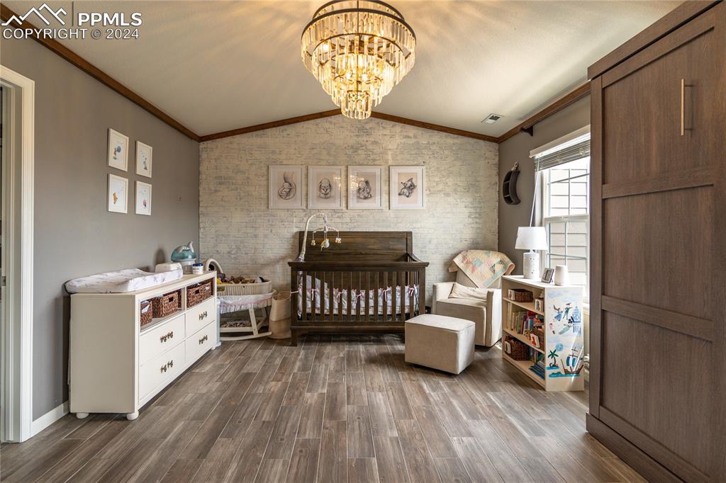 1166 Walters Point Monument, CO 80132 - Photo 14 of 21 a bedroom with furniture and a window