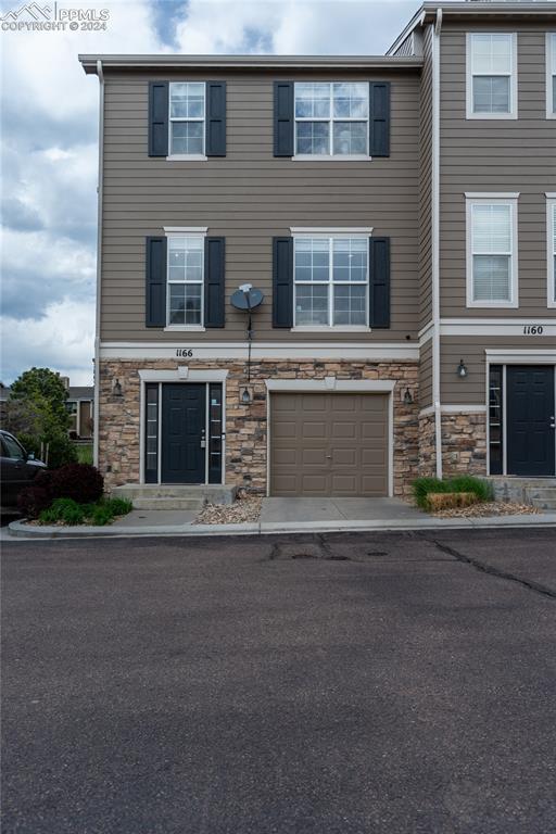 1166 Walters Point Monument, CO 80132 - Photo 19 of 21 a front view of a house with a yard