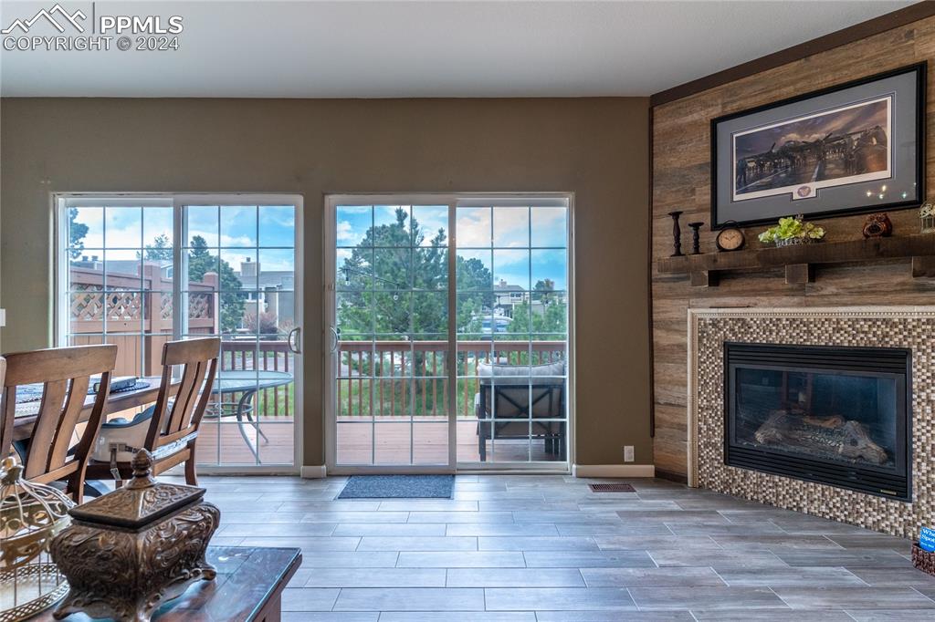 1166 Walters Point Monument, CO 80132 - Photo 2 of 21 a living room with furniture and a fireplace