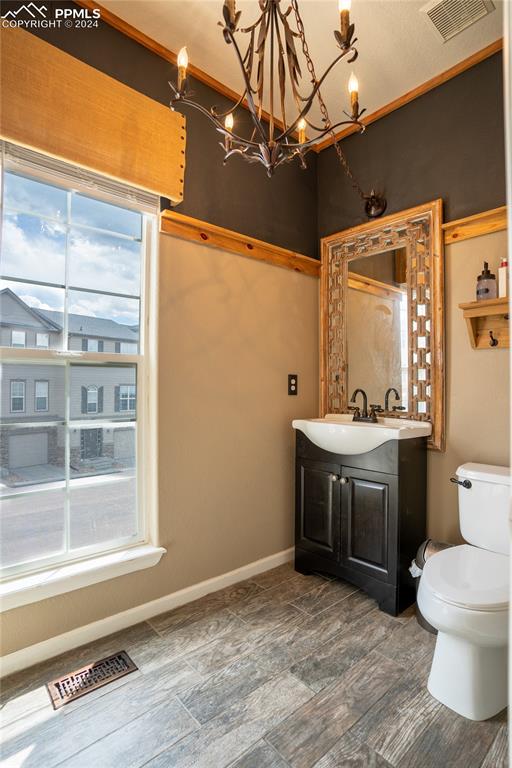 1166 Walters Point Monument, CO 80132 - Photo 7 of 21 a bathroom with a sink vanity mirror and toilet