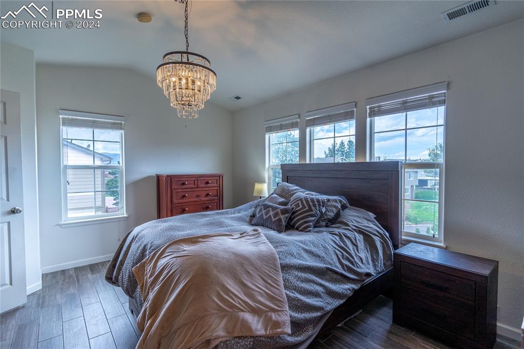 1166 Walters Point Monument, CO 80132 - Photo 10 of 21 a bedroom with a bed and a window