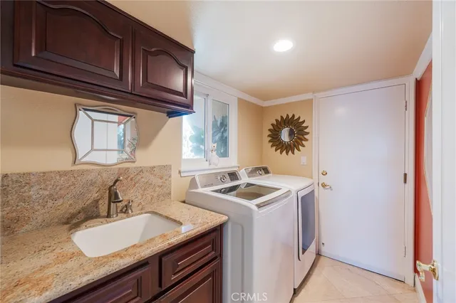 a view of a house with backyard porch and sitting area