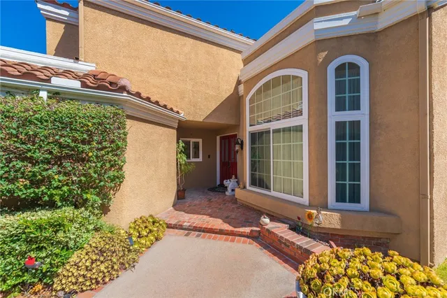 a view of sign board with flower around