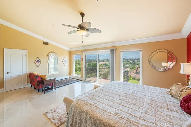 a bedroom with a bed couch and window