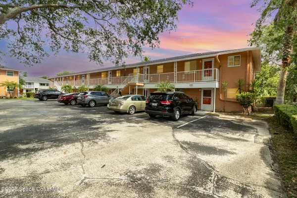 a view of a cars in front of a building