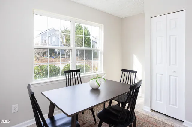 a living room with furniture and a mirror