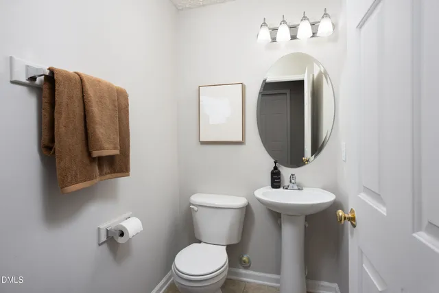a living room with furniture flowerpot and window