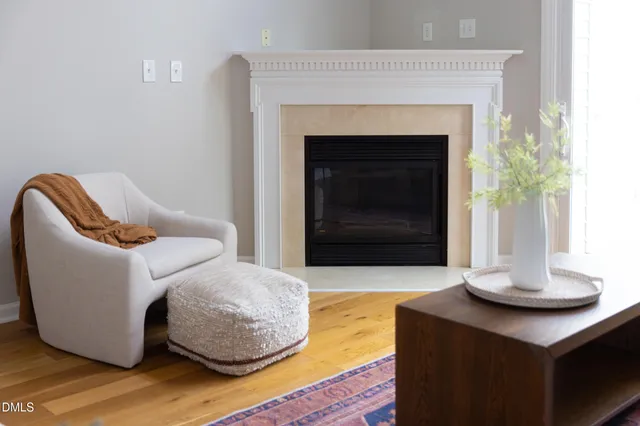 a bedroom with a bed and a potted plant