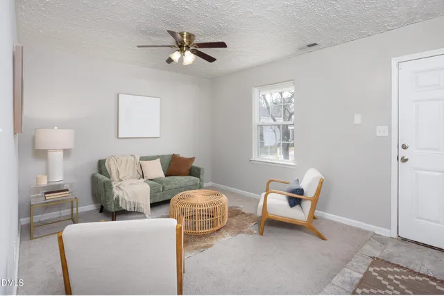 a bedroom with a bed and chandelier
