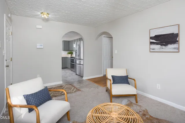 a kitchen with a sink and stainless steel appliances