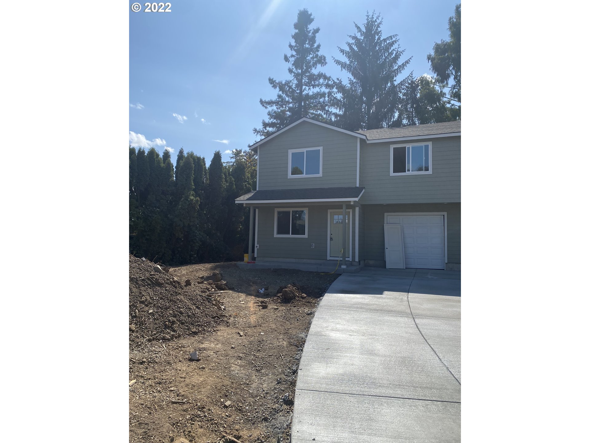 a front view of a house with yard