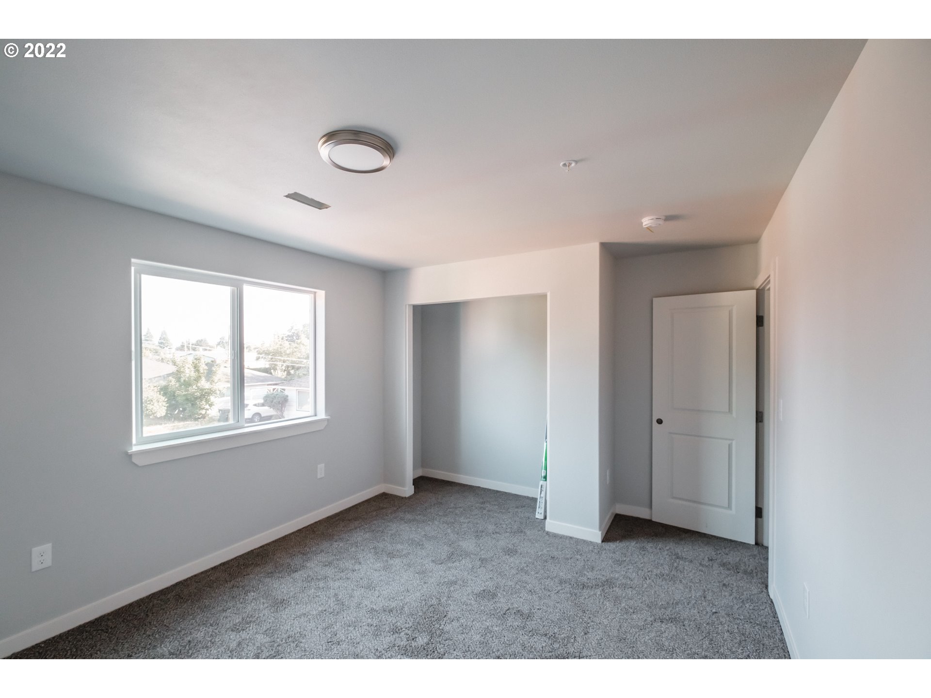1671 Cooper Street Lebanon, OR 97355 - Photo 11 of 32 a view of an empty room with a window