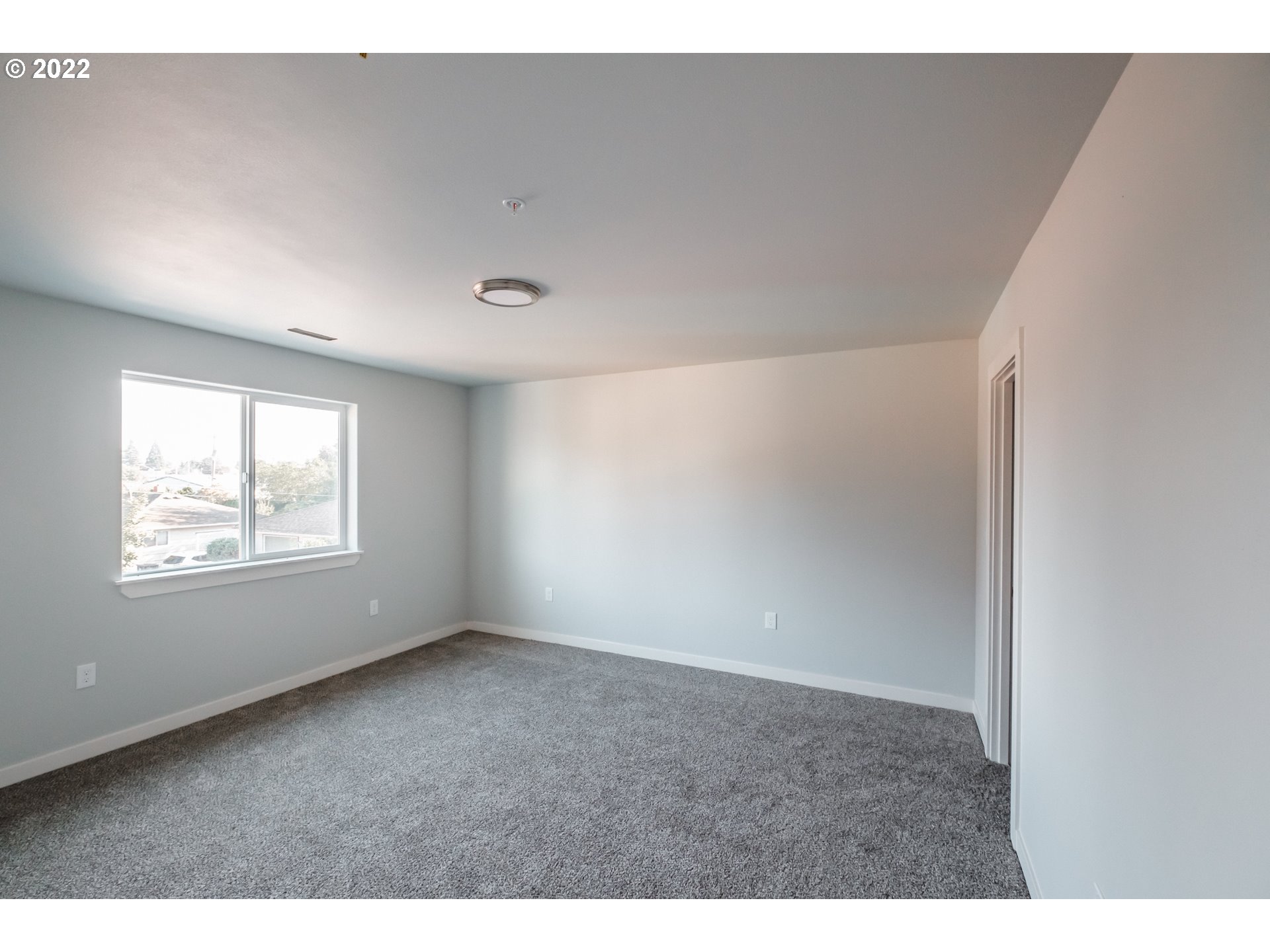 1671 Cooper Street Lebanon, OR 97355 - Photo 12 of 32 a view of an empty room with a window