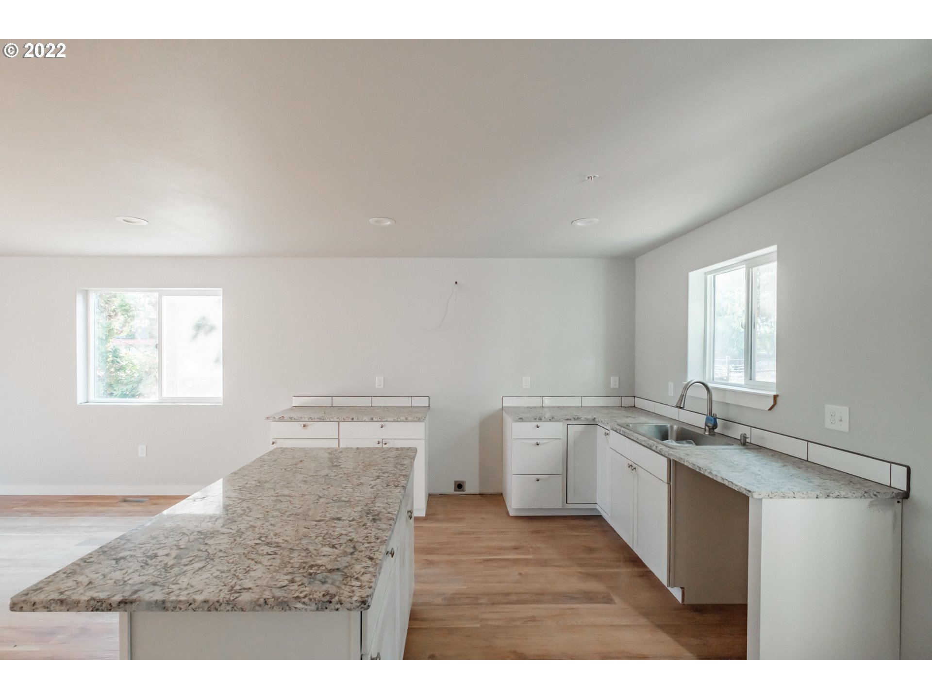 1671 Cooper Street Lebanon, OR 97355 - Photo 19 of 32 a kitchen with a sink stove and cabinets