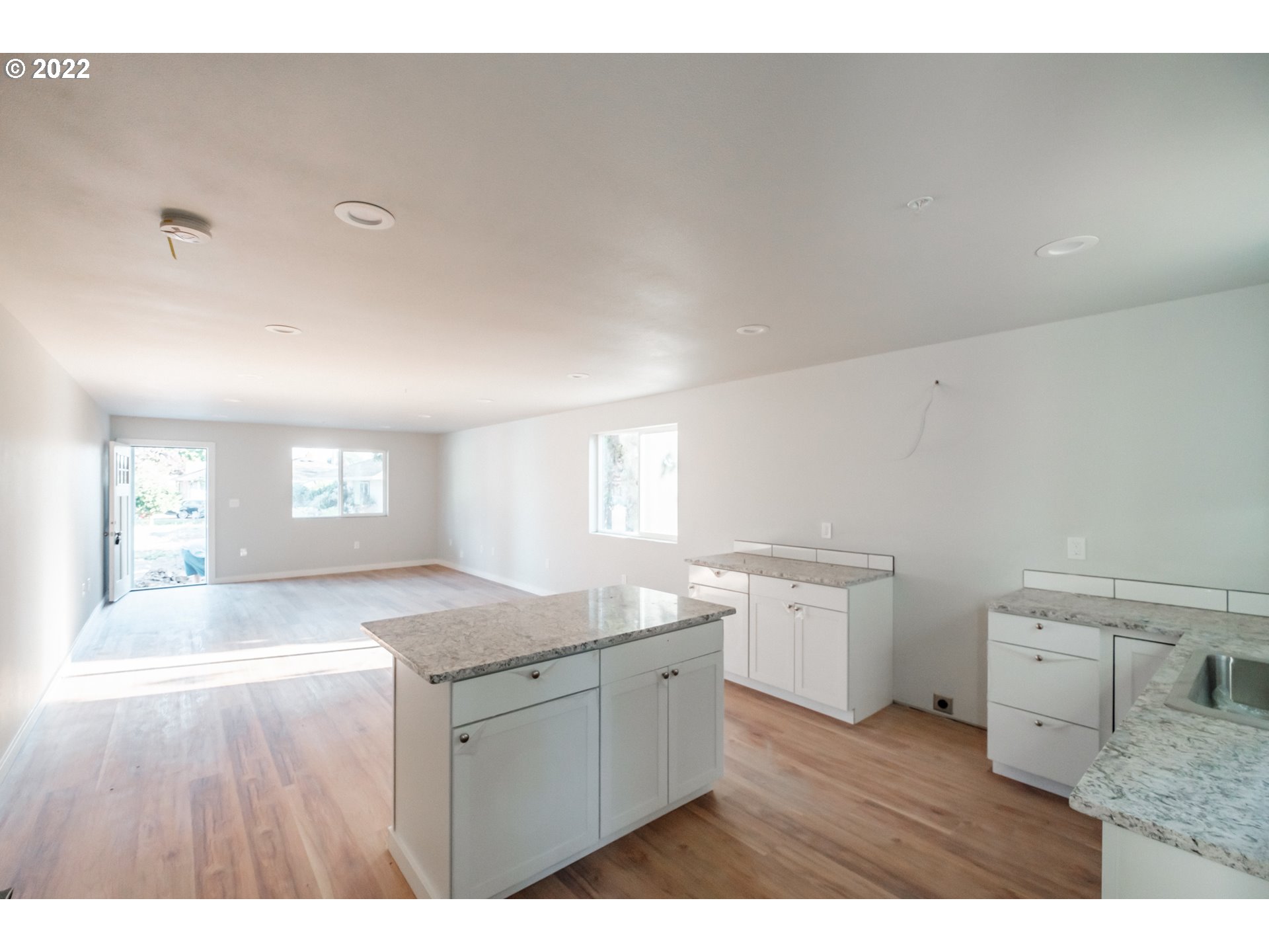 1671 Cooper Street Lebanon, OR 97355 - Photo 20 of 32 a kitchen with a sink cabinets and wooden floor