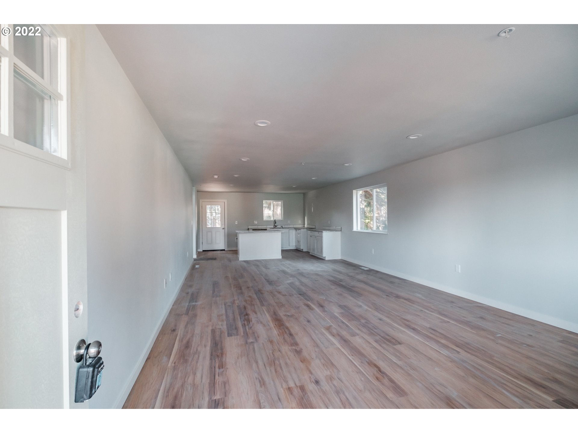 1671 Cooper Street Lebanon, OR 97355 - Photo 2 of 32 a view of empty room with wooden floor and fan