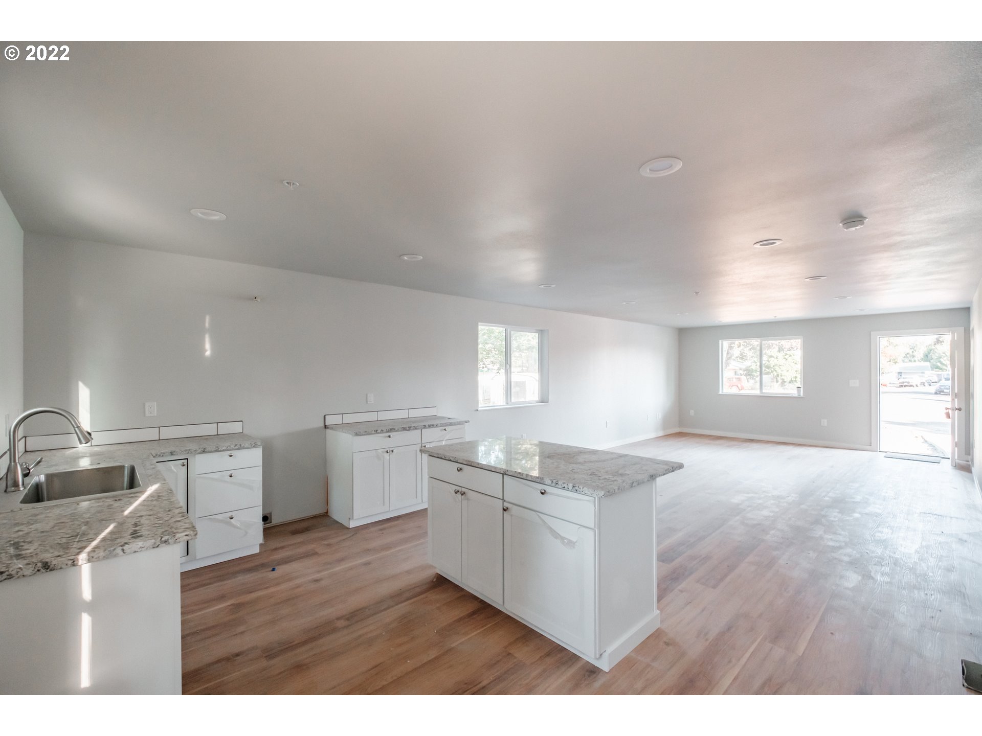 1671 Cooper Street Lebanon, OR 97355 - Photo 5 of 32 a kitchen with a stove a sink and a refrigerator