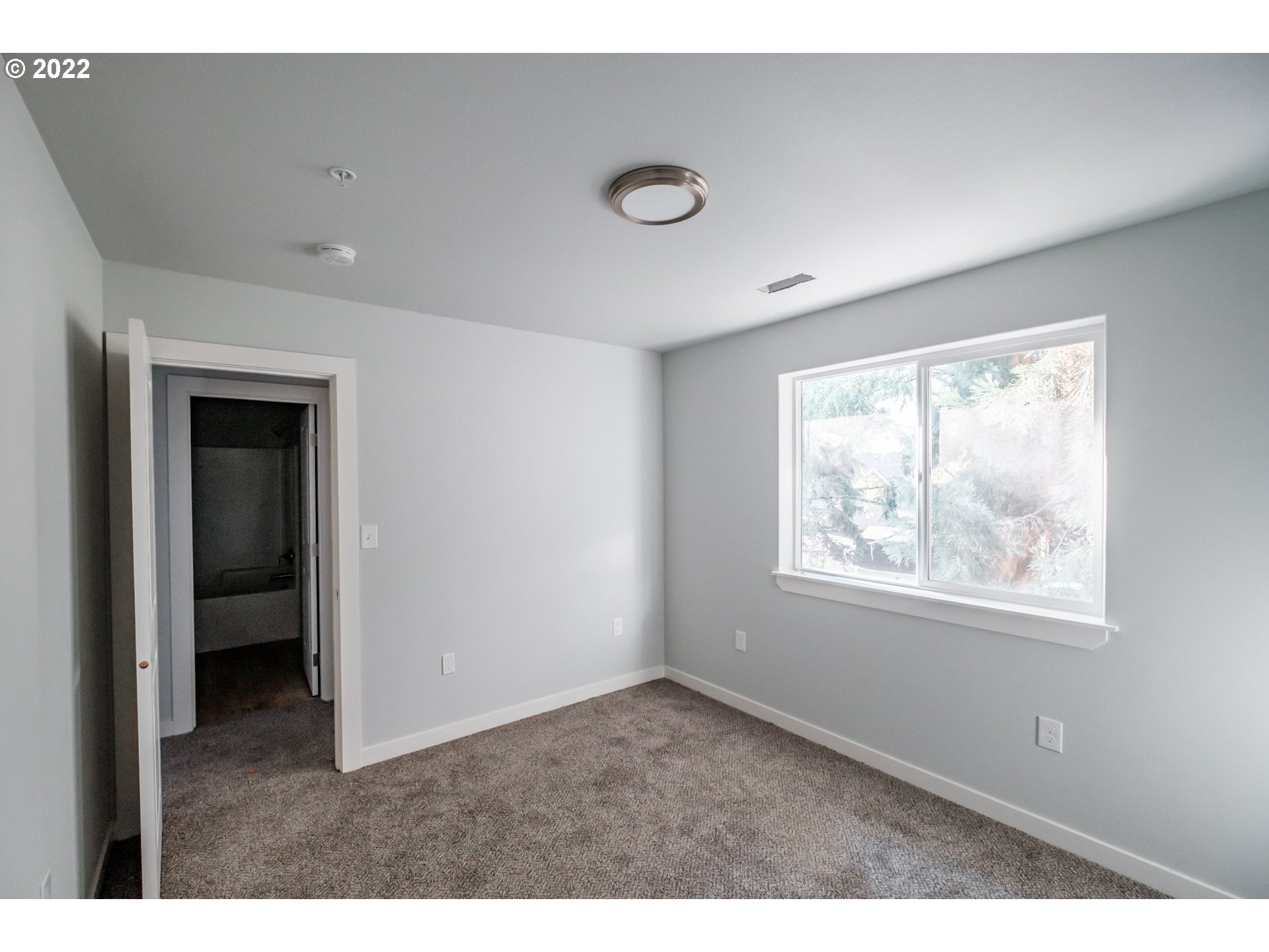 1671 Cooper Street Lebanon, OR 97355 - Photo 8 of 32 a view of an empty room with a window