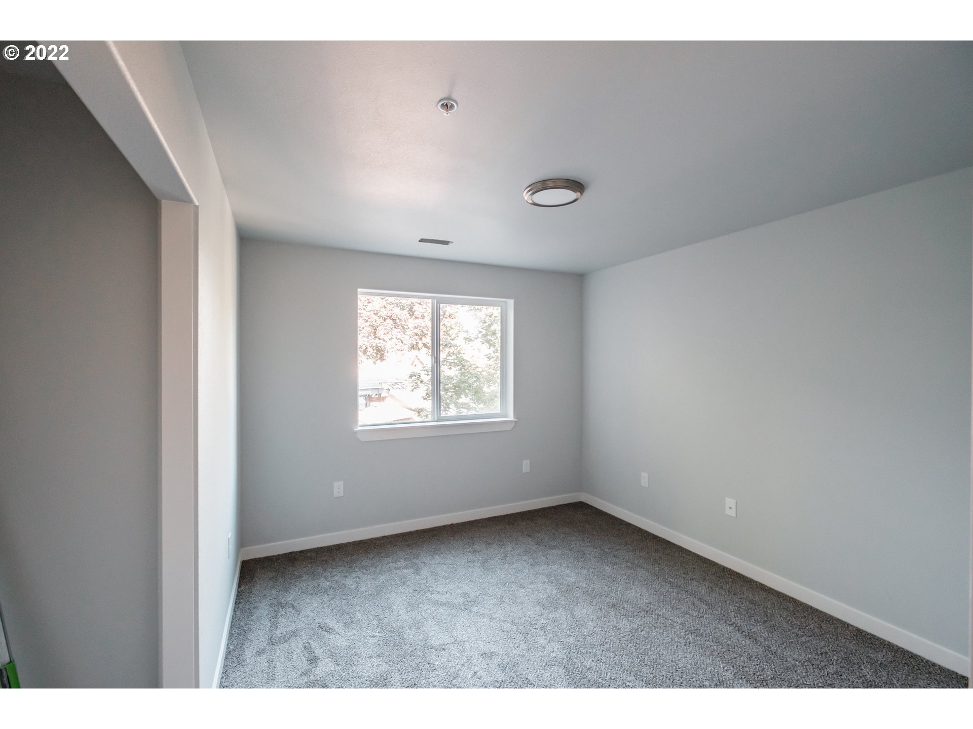 1671 Cooper Street Lebanon, OR 97355 - Photo 9 of 32 a view of an empty room with a window